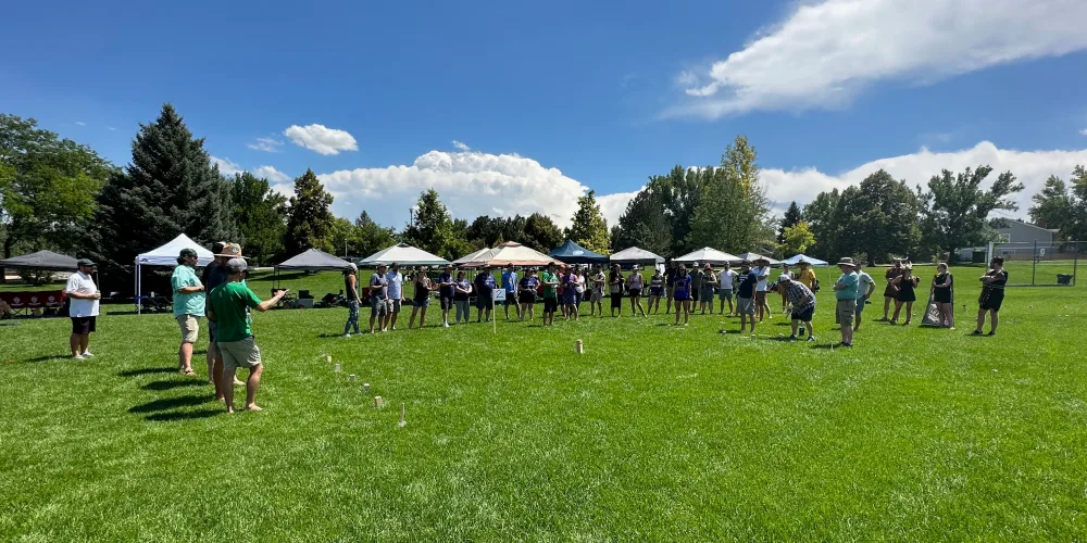 A player throws a baton on a Kubb field